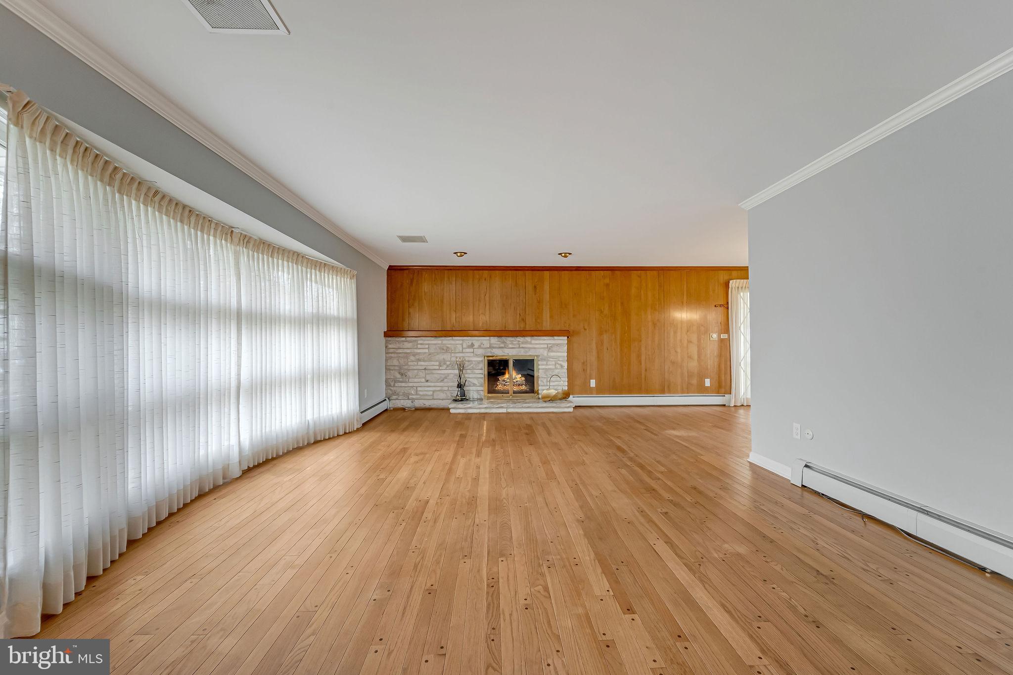 2 Cedar Lane Pemberton, NJ 08068 - Photo 12 of 56 a view of an empty room with wooden floor and a window