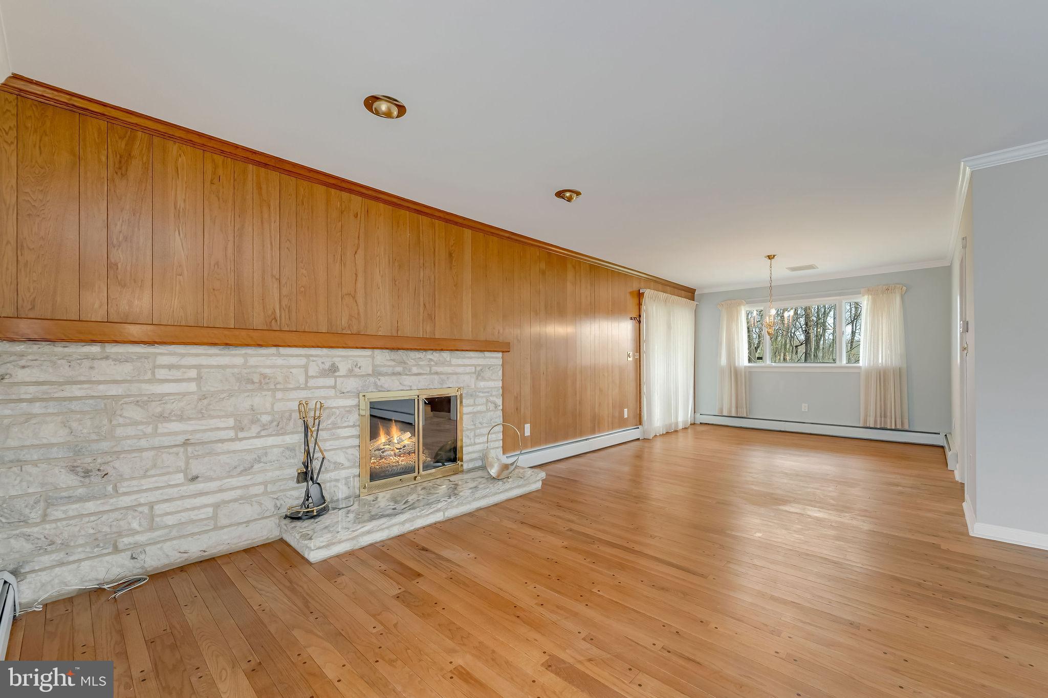 2 Cedar Lane Pemberton, NJ 08068 - Photo 13 of 56 a view of an empty room with a window and wooden floor