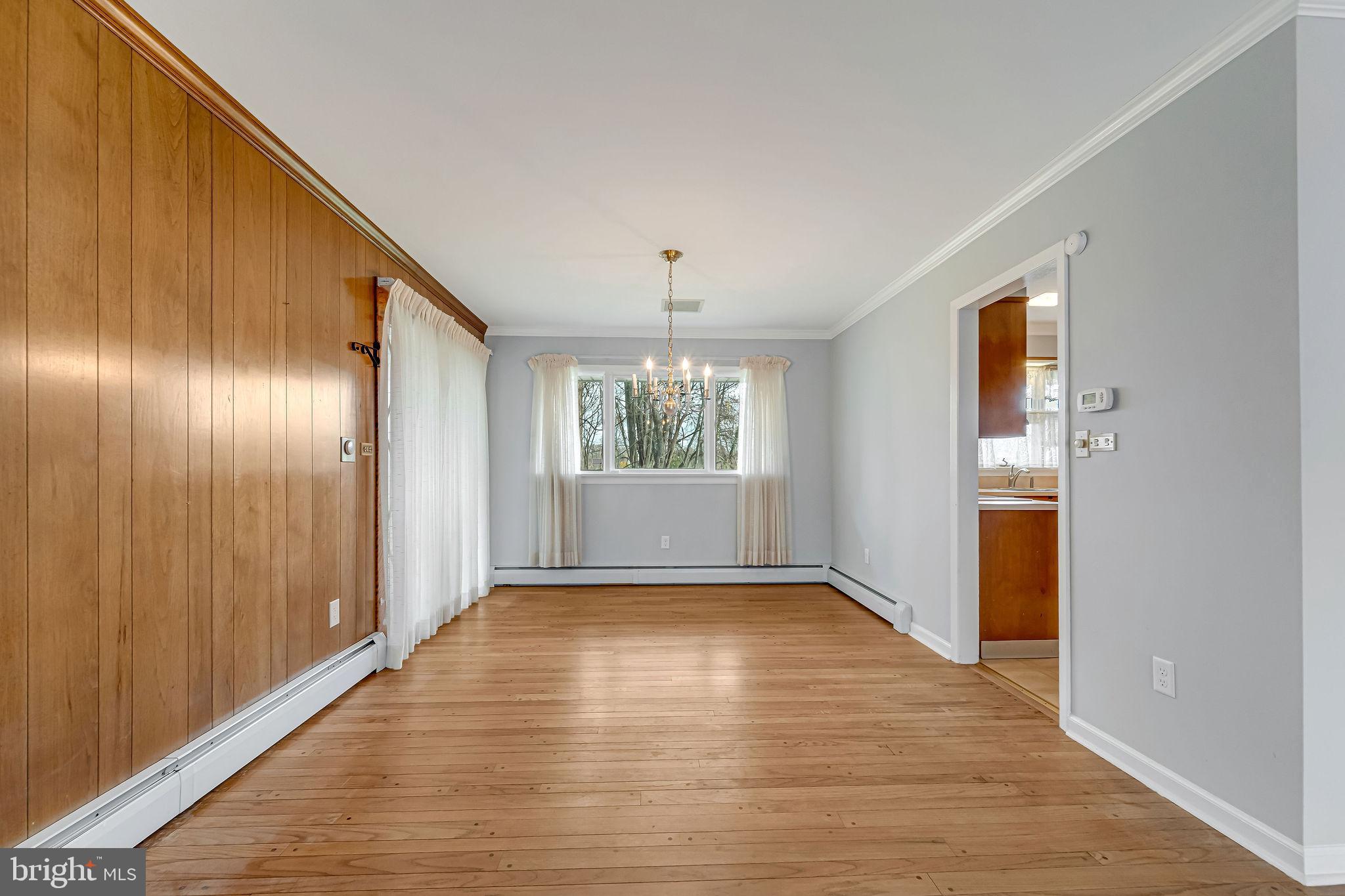 2 Cedar Lane Pemberton, NJ 08068 - Photo 15 of 56 a view of an empty room with wooden floor and a window