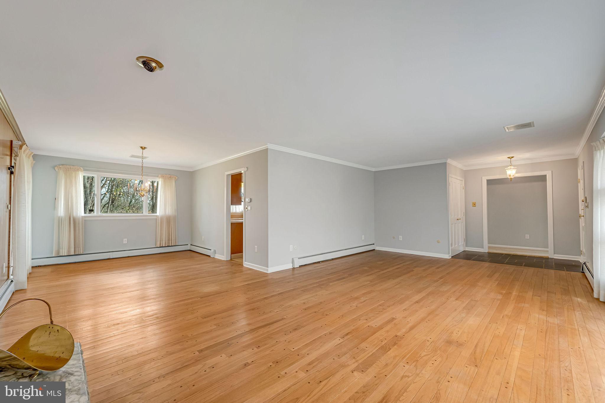 2 Cedar Lane Pemberton, NJ 08068 - Photo 17 of 56 a view of an empty room with wooden floor and a window