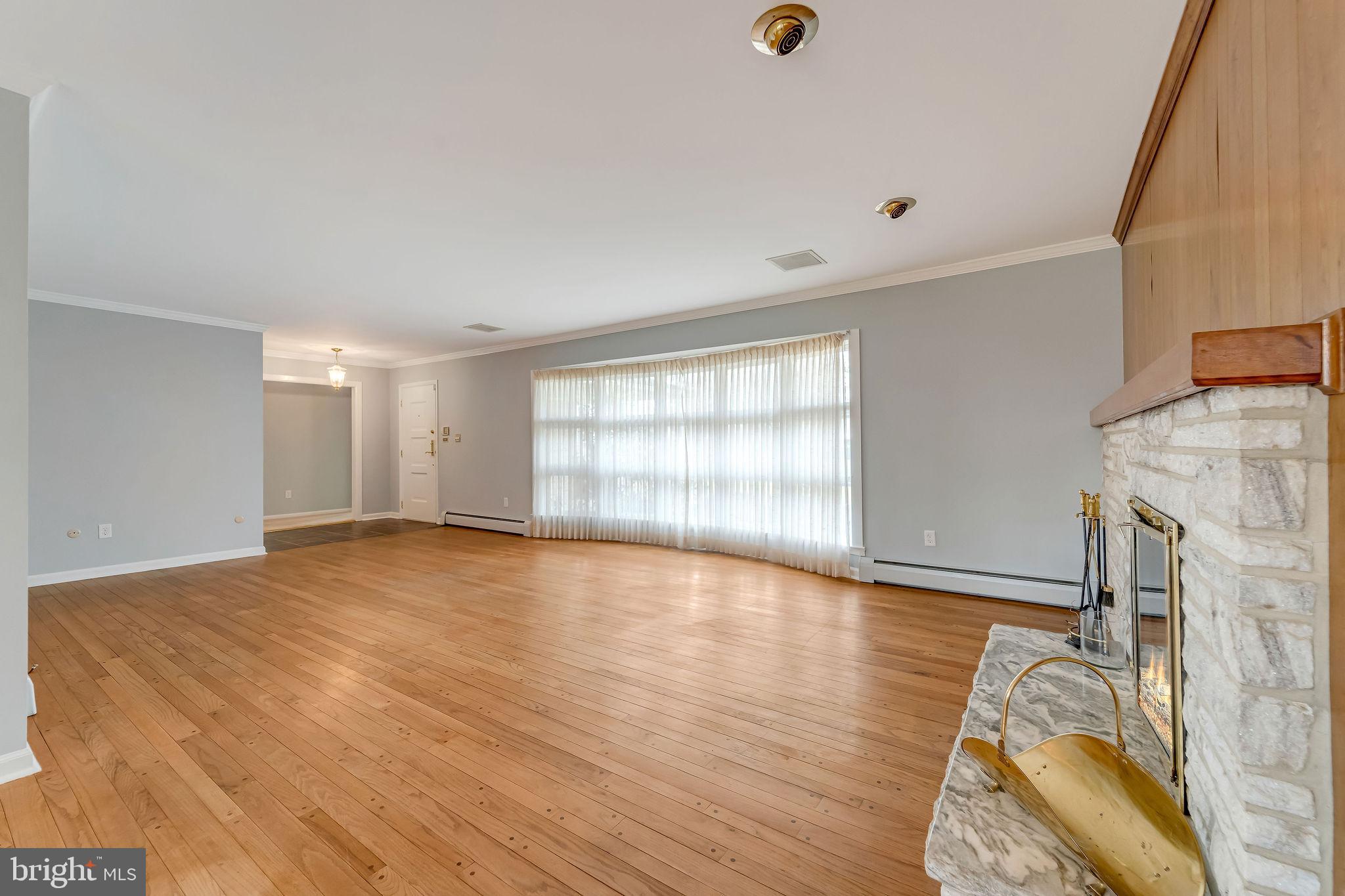 2 Cedar Lane Pemberton, NJ 08068 - Photo 18 of 56 a view of an empty room with wooden floor and a window