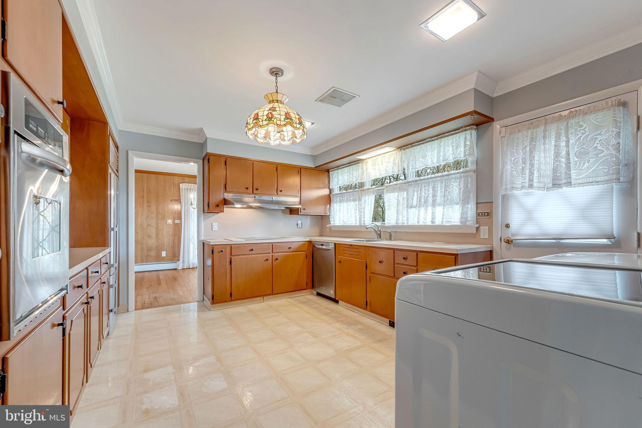 2 Cedar Lane Pemberton, NJ 08068 - Photo 21 of 56 a kitchen with stainless steel appliances granite countertop a sink cabinets and window