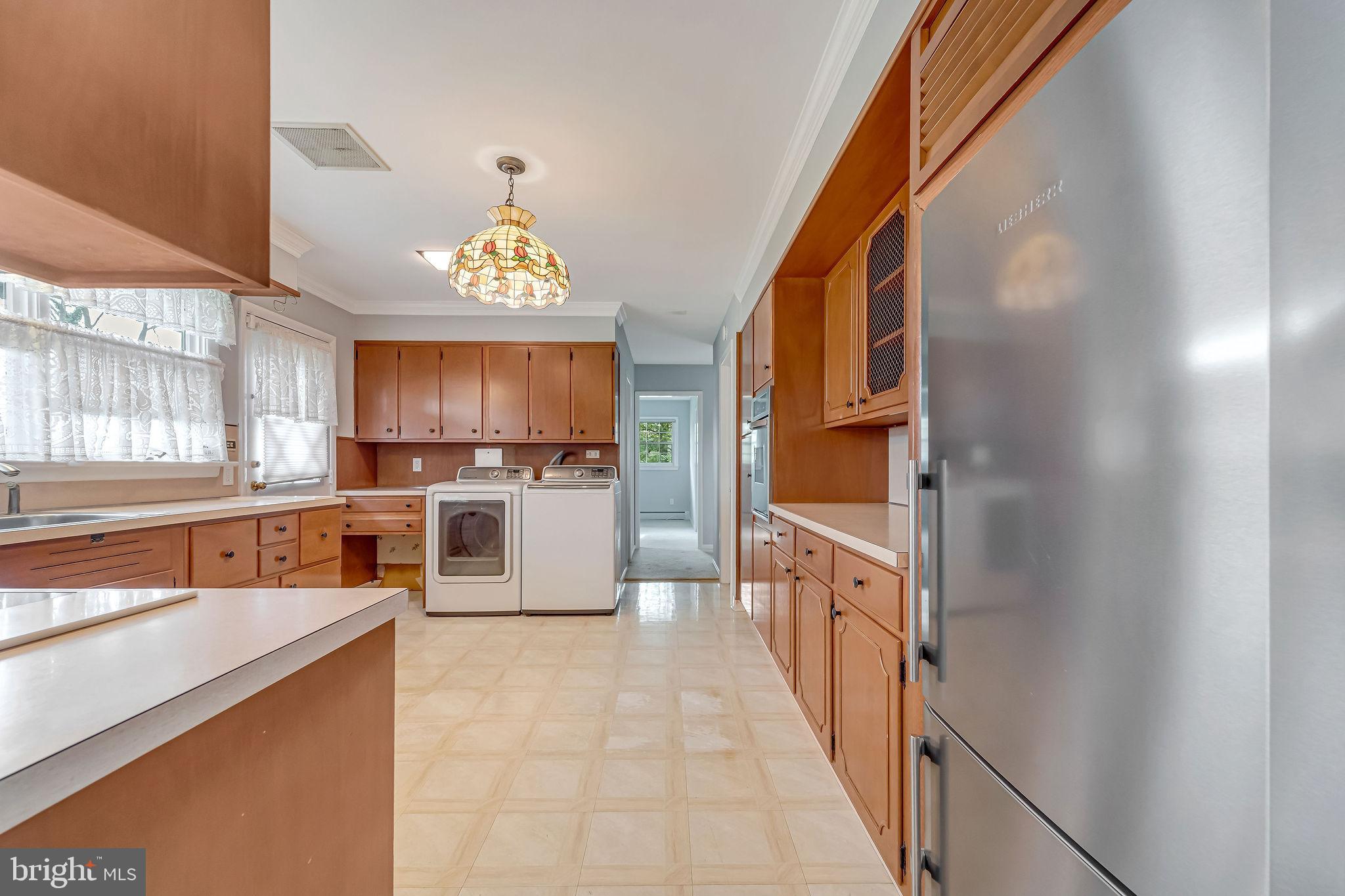 2 Cedar Lane Pemberton, NJ 08068 - Photo 22 of 56 a kitchen with stainless steel appliances granite countertop a stove a sink and a refrigerator