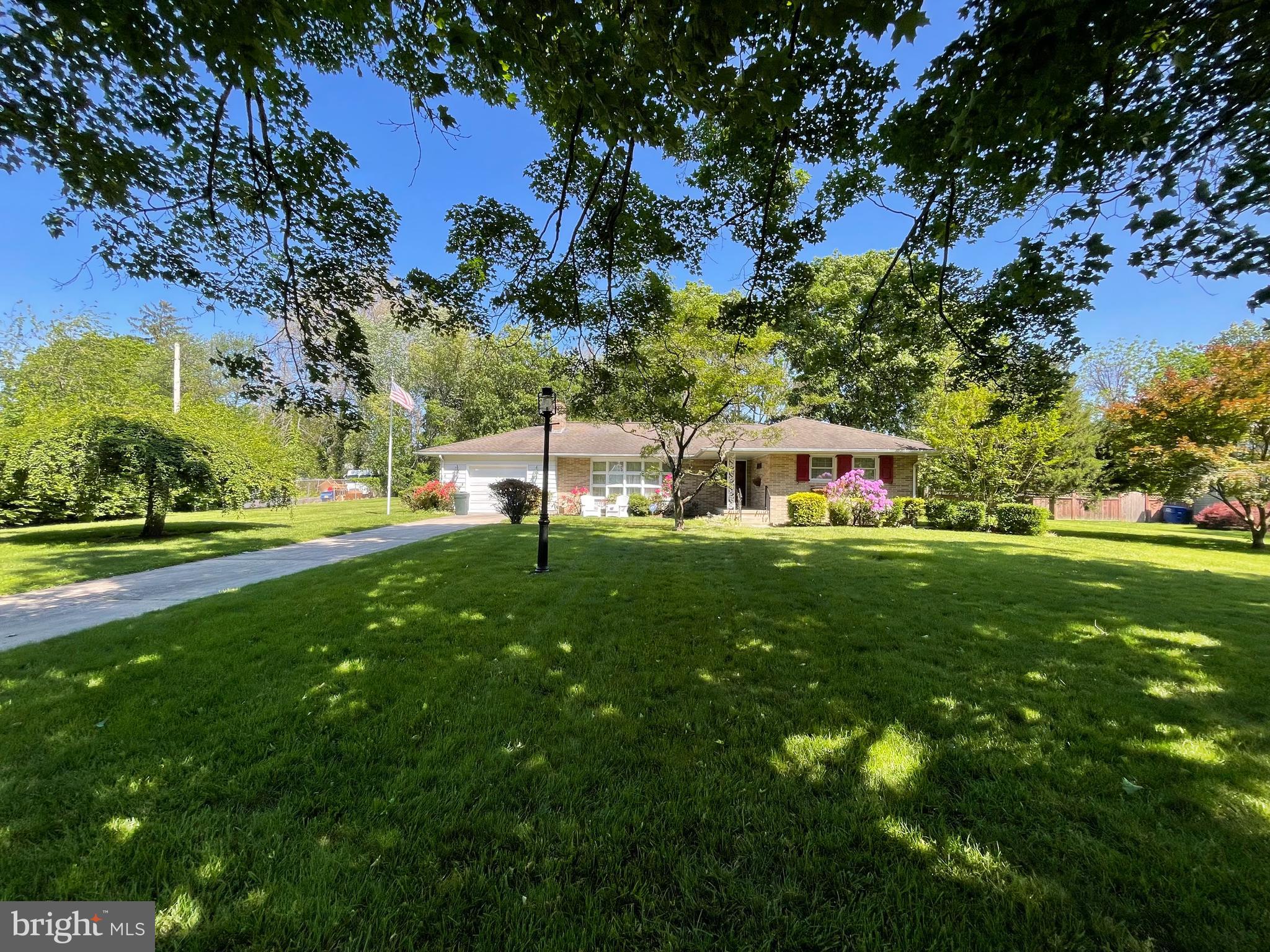 2 Cedar Lane Pemberton, NJ 08068 - Photo 44 of 56 a front view of a house with garden and trees