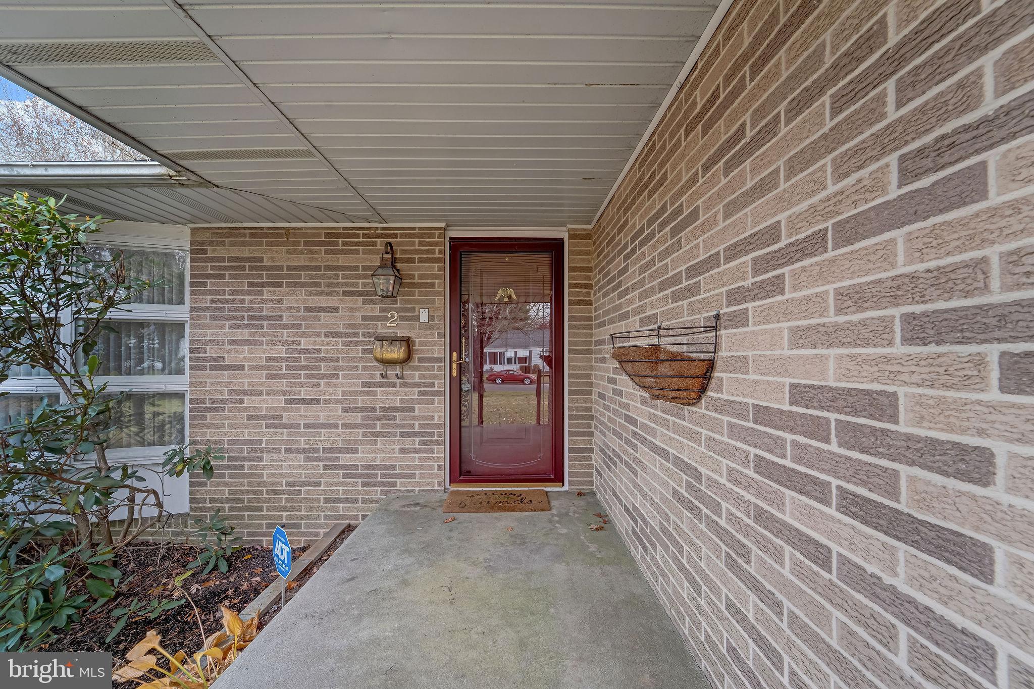 2 Cedar Lane Pemberton, NJ 08068 - Photo 8 of 56 a view of a brick house with a door