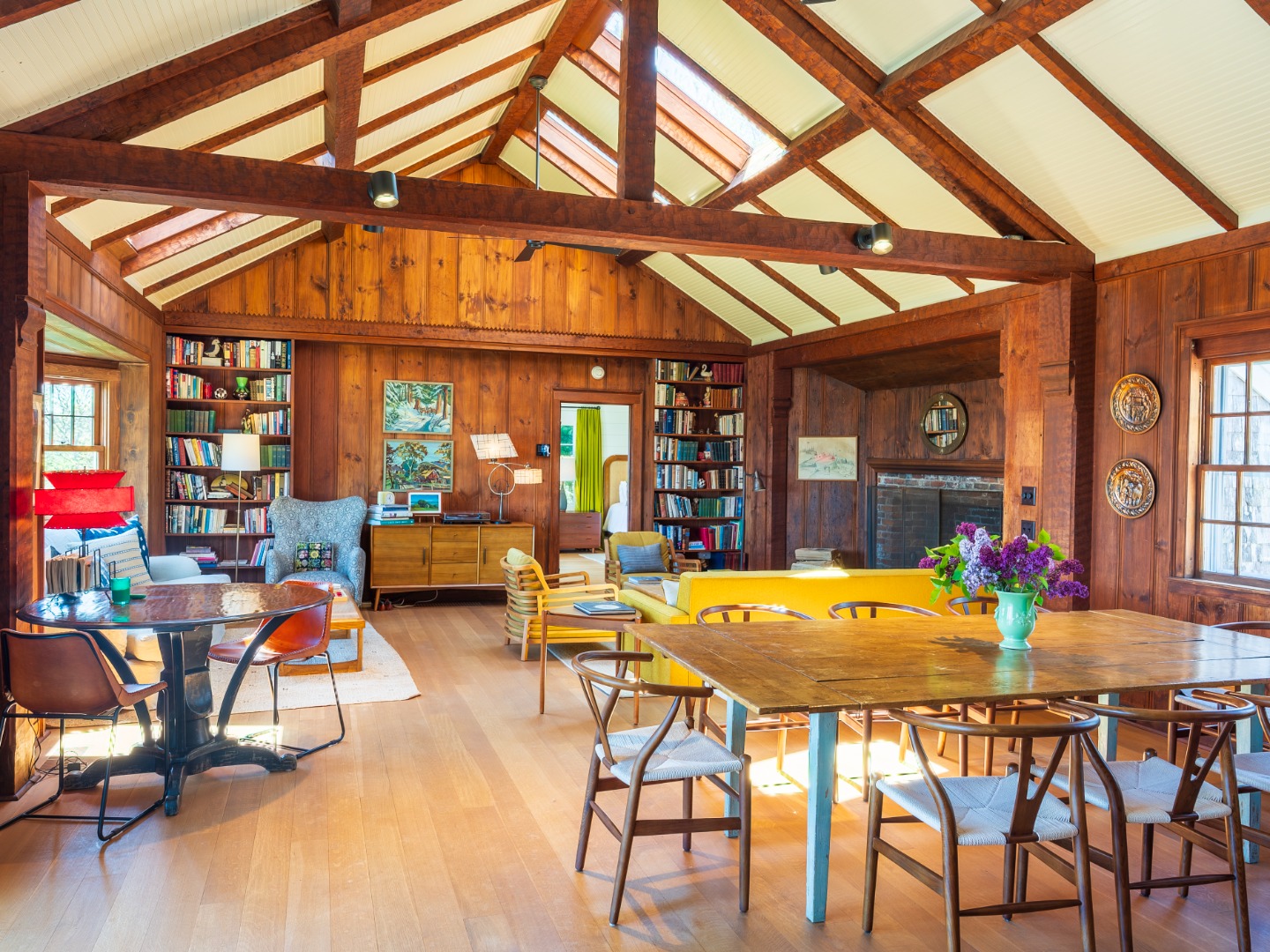 6 Wakeman Road Chilmark, MA 02535 - Photo 24 of 51 Great room with a fireplace, living room and dining room. Doors on both sides of the room leading to a private patio and firepit as well as a deck on the south side.