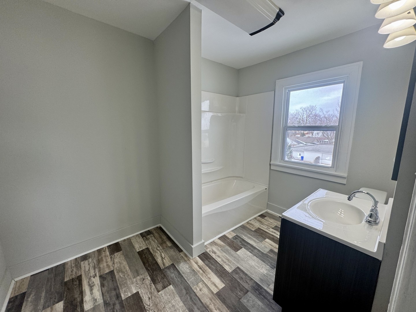312 East Division Street Kewanee, IL 61443 - Photo 11 of 11 a bathroom with a sink and a bathtub