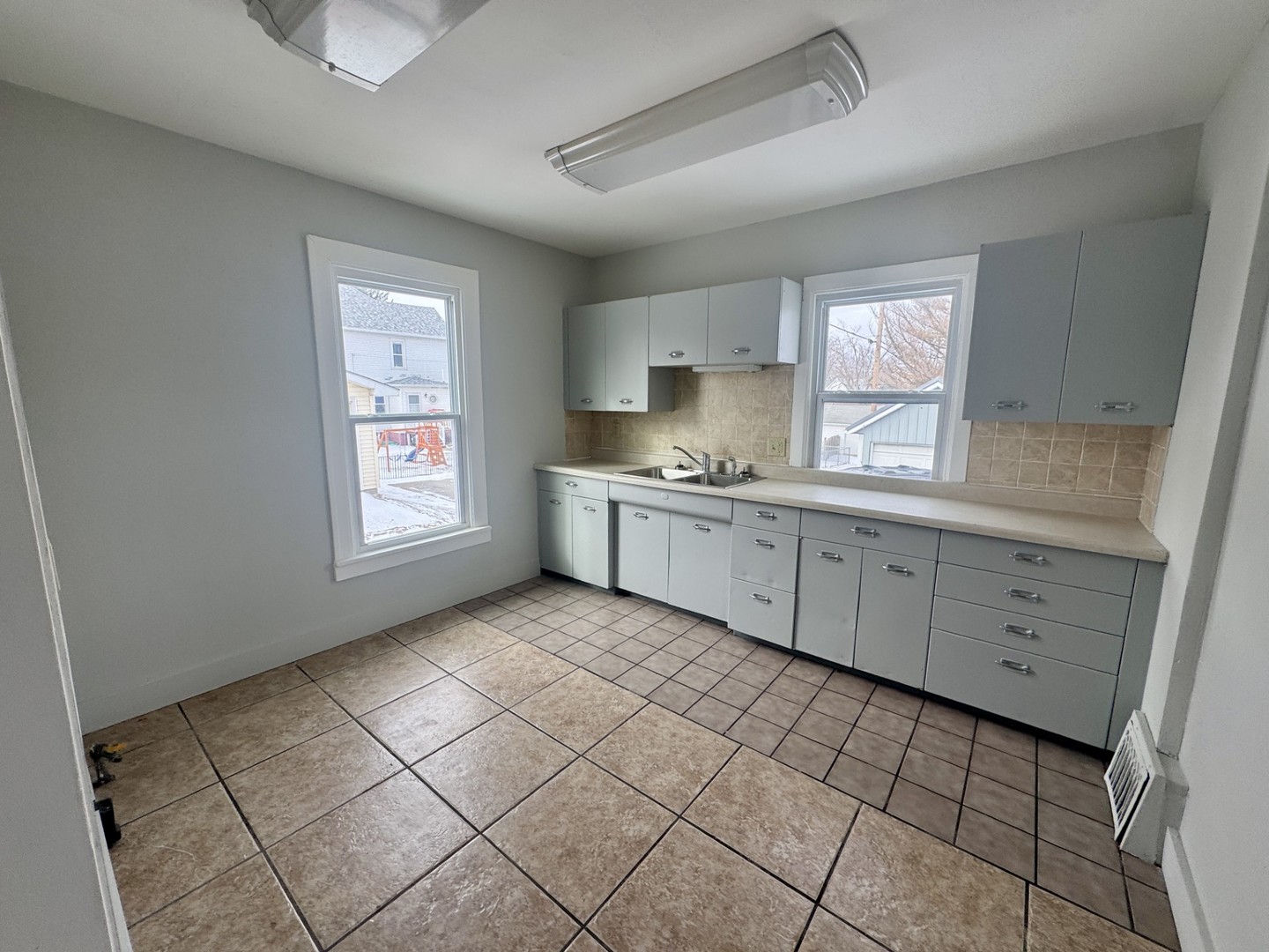312 East Division Street Kewanee, IL 61443 - Photo 2 of 11 a kitchen with a sink a window and cabinets