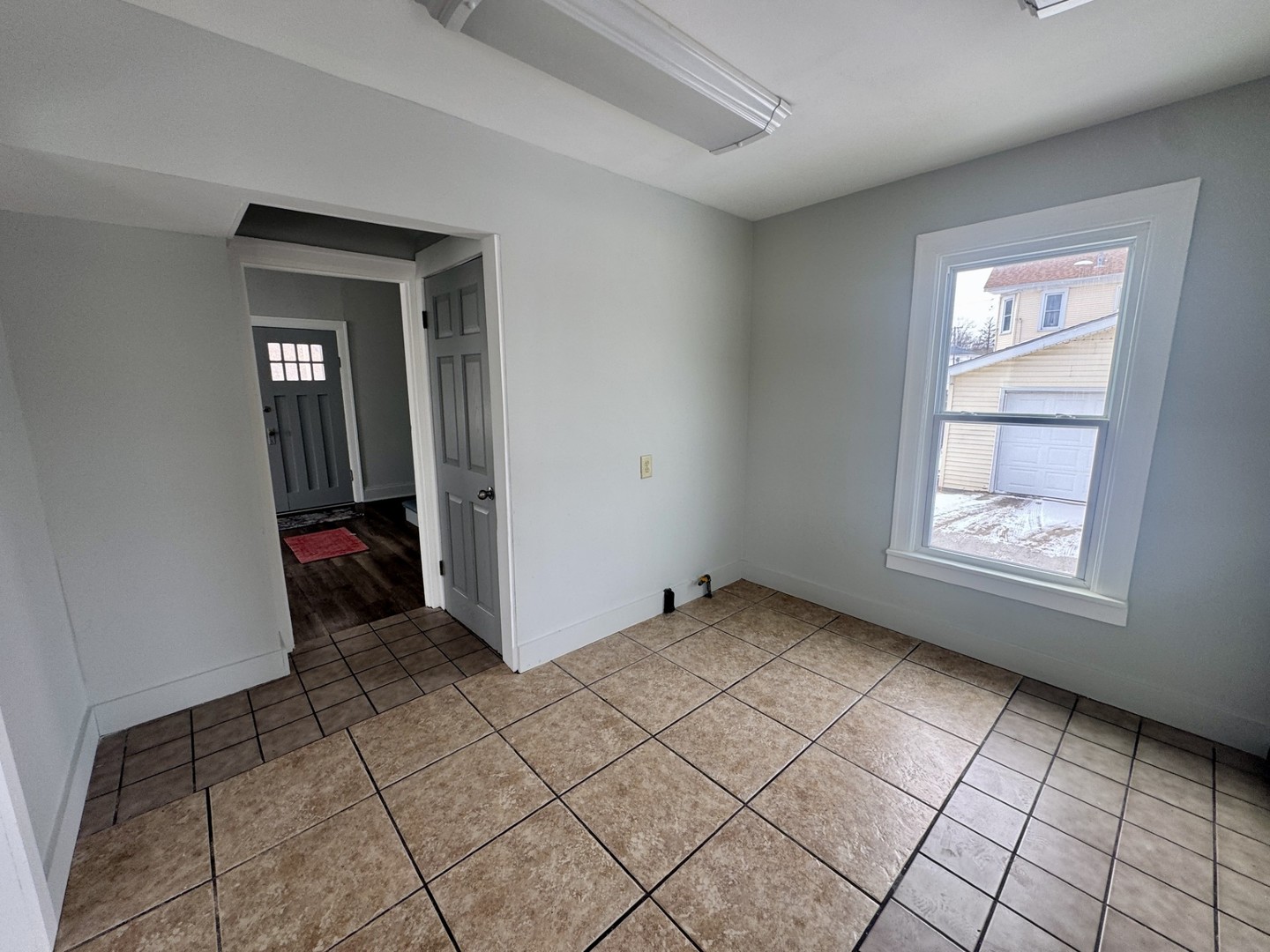 312 East Division Street Kewanee, IL 61443 - Photo 3 of 11 a view of an empty room and window