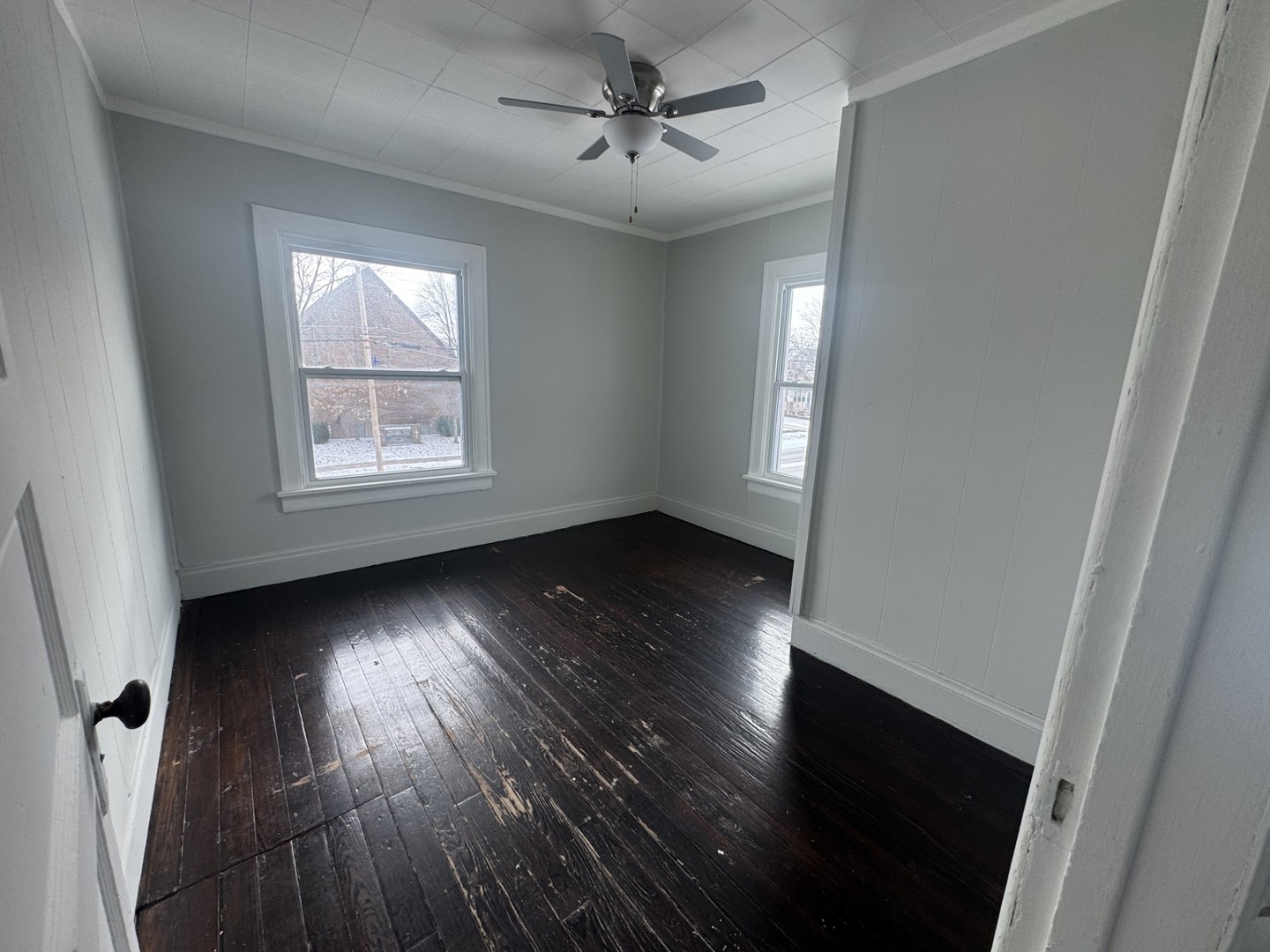 312 East Division Street Kewanee, IL 61443 - Photo 8 of 11 an empty room with wooden floor and windows