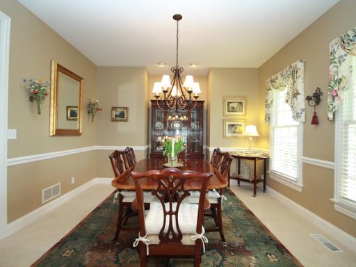 7N050 Ridge Line Road St. Charles, IL 60175 - Photo 3 of 16 a dining room with furniture a chandelier and wooden floor