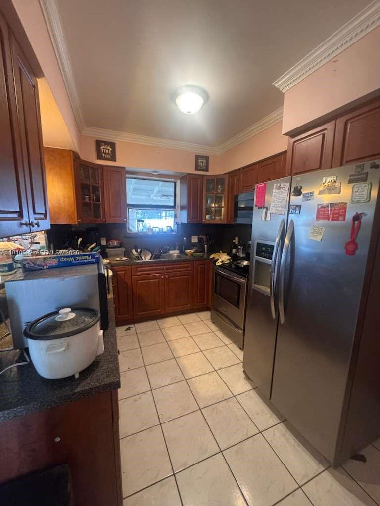 14800 Southwest 296th Street Homestead, FL 33033 - Photo 12 of 28 a kitchen with stainless steel appliances granite countertop a refrigerator a stove a sink and a microwave