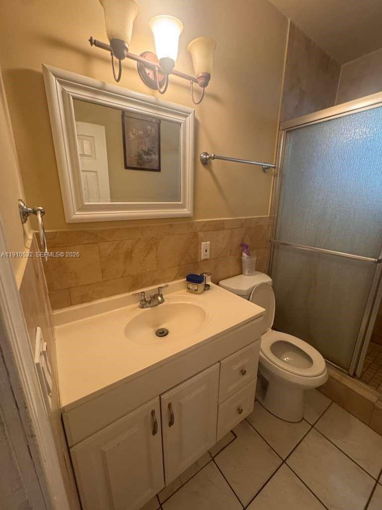 14800 Southwest 296th Street Homestead, FL 33033 - Photo 13 of 28 a bathroom with a toilet sink and mirror