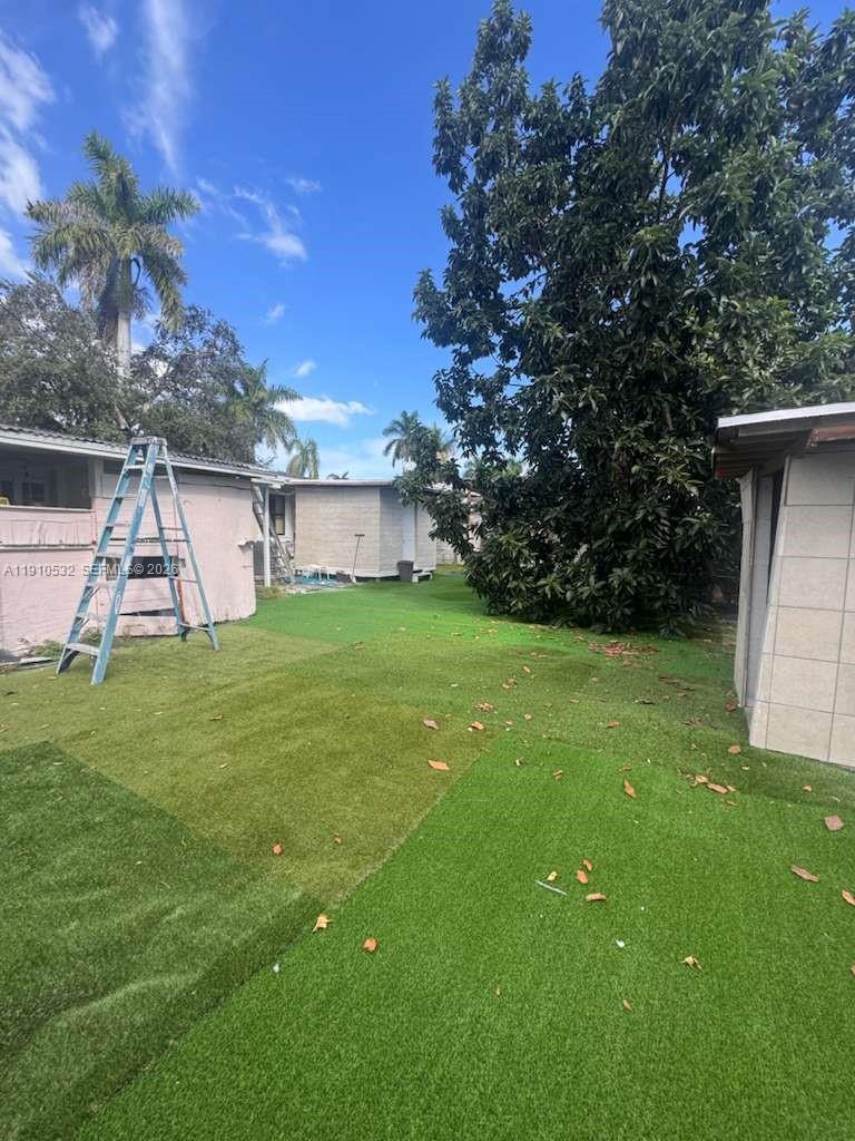 14800 Southwest 296th Street Homestead, FL 33033 - Photo 16 of 28 a view of a backyard with a garden and entertaining space