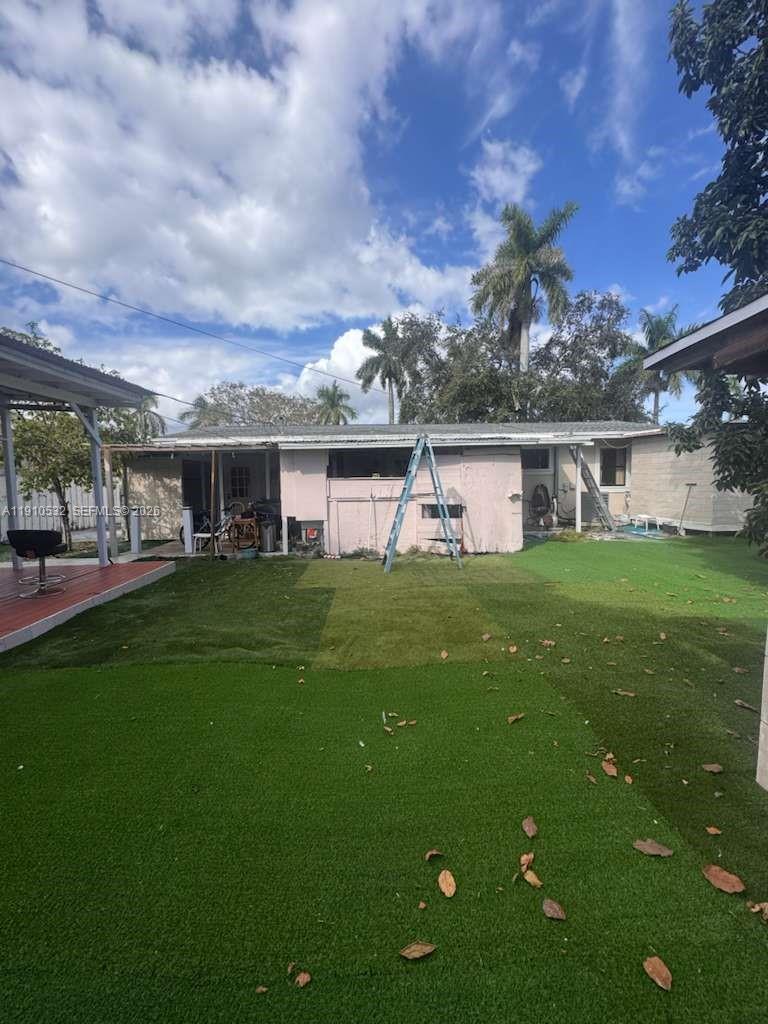 14800 Southwest 296th Street Homestead, FL 33033 - Photo 18 of 28 a front view of house with yard and green space