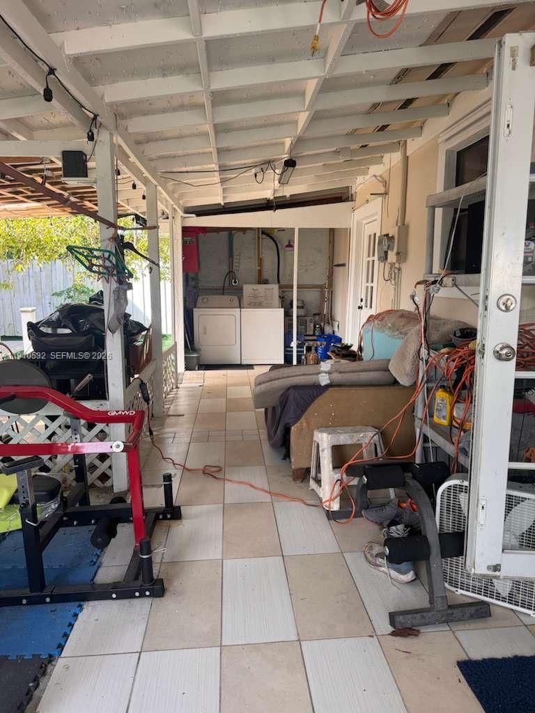 14800 Southwest 296th Street Homestead, FL 33033 - Photo 20 of 28 a room with lots of furniture and a flat screen tv