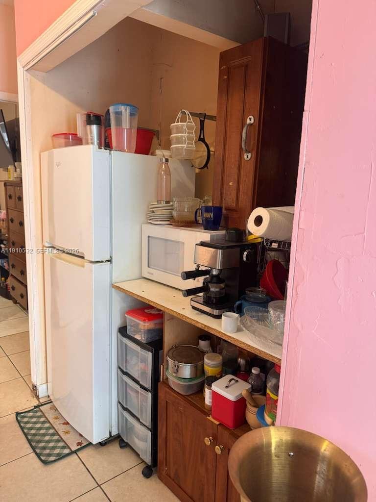 14800 Southwest 296th Street Homestead, FL 33033 - Photo 21 of 28 a kitchen with stainless steel appliances granite countertop a refrigerator and a stove