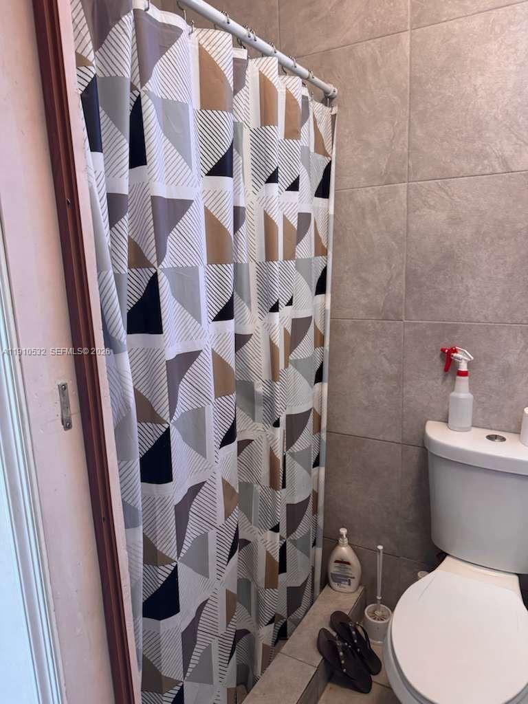 14800 Southwest 296th Street Homestead, FL 33033 - Photo 25 of 28 a white toilet sitting next to a bathroom sink