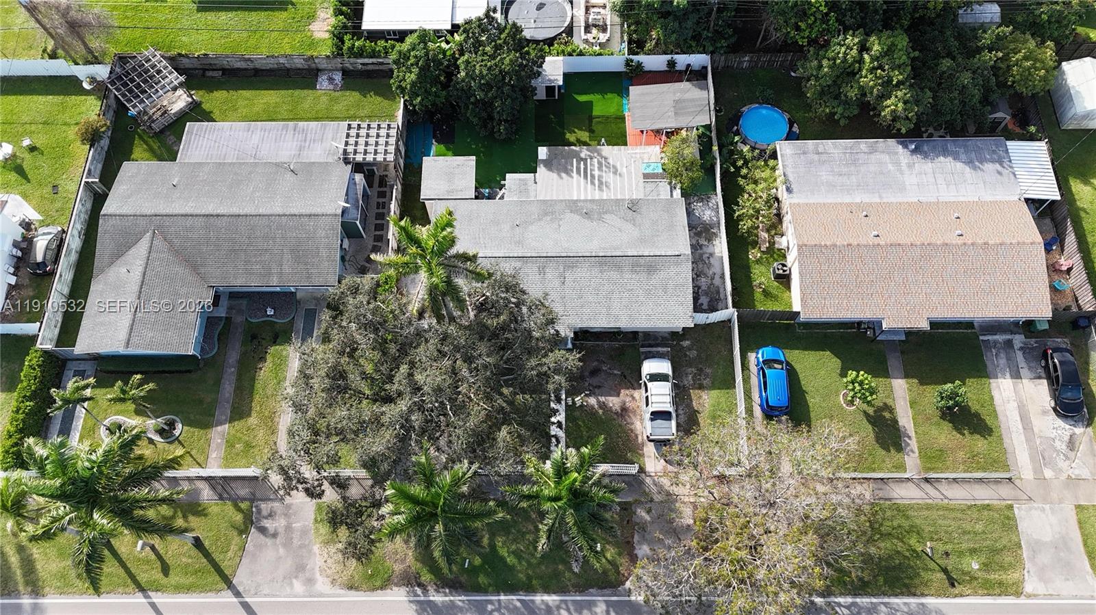 14800 Southwest 296th Street Homestead, FL 33033 - Photo 8 of 28 an aerial view of a house with swimming pool and large trees