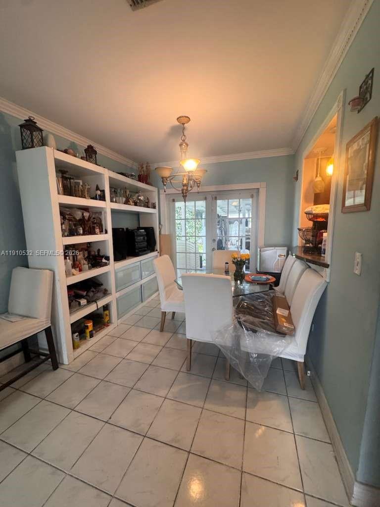 14800 Southwest 296th Street Homestead, FL 33033 - Photo 9 of 28 a living room with furniture a flat screen tv and a window