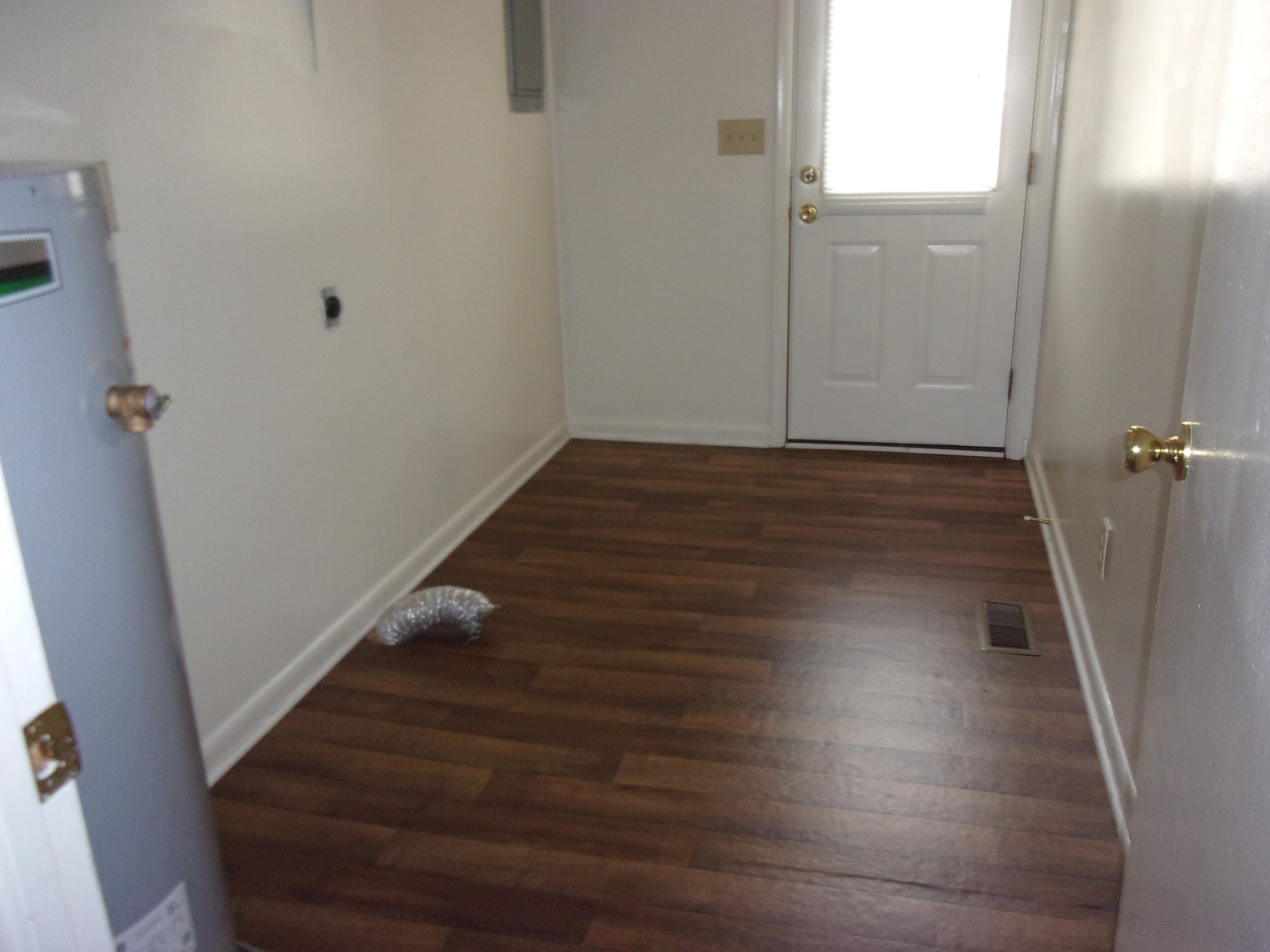 131 Quita Circle, Unit B Lebanon, TN 37087 - Photo 2 of 6 a view of a hallway with wooden floor and staircase