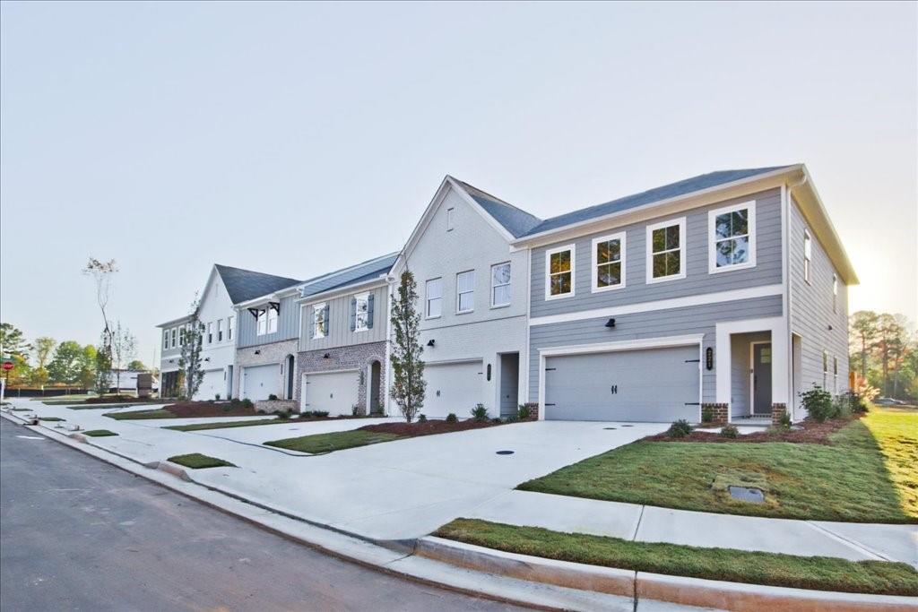313 Colsen Drive Acworth, GA 30102 - Photo 12 of 37 a front view of a house with a yard and garage