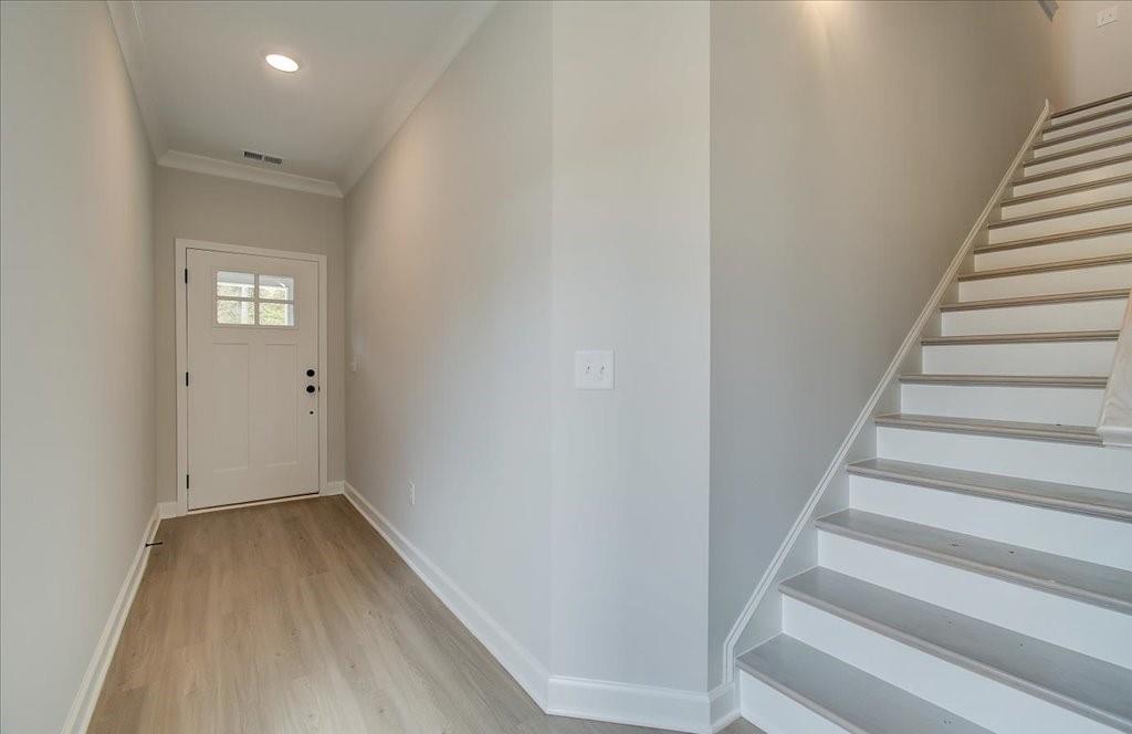 313 Colsen Drive Acworth, GA 30102 - Photo 14 of 37 a view of a hallway with wooden floor and entryway