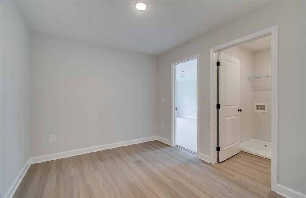 313 Colsen Drive Acworth, GA 30102 - Photo 24 of 37 a view of an empty room and wooden floor
