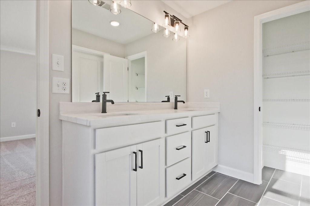 313 Colsen Drive Acworth, GA 30102 - Photo 31 of 37 a bathroom with a double vanity sink mirror and