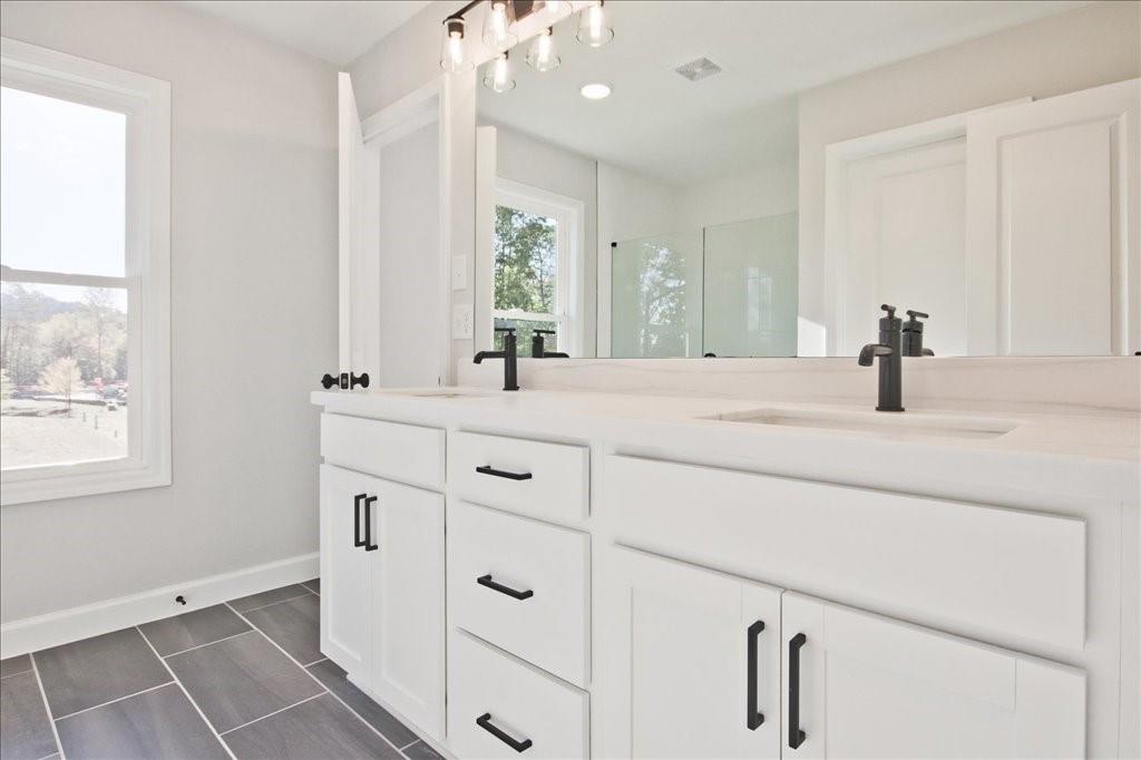 313 Colsen Drive Acworth, GA 30102 - Photo 32 of 37 a bathroom with a sink and a mirror