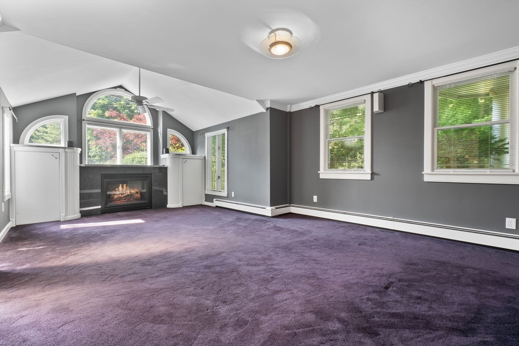 11 Bartlett Place Amesbury, MA 01913 - Photo 15 of 41 an empty room with windows and fireplace
