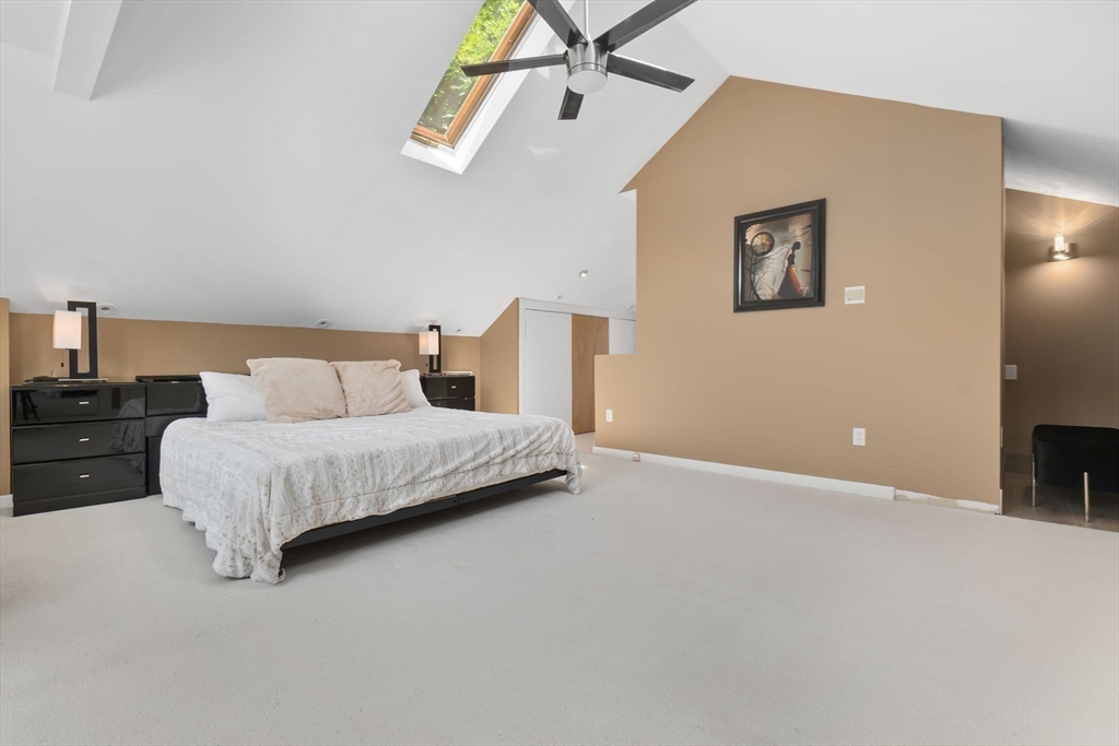 11 Bartlett Place Amesbury, MA 01913 - Photo 18 of 41 a bedroom with a bed and a view of kitchen