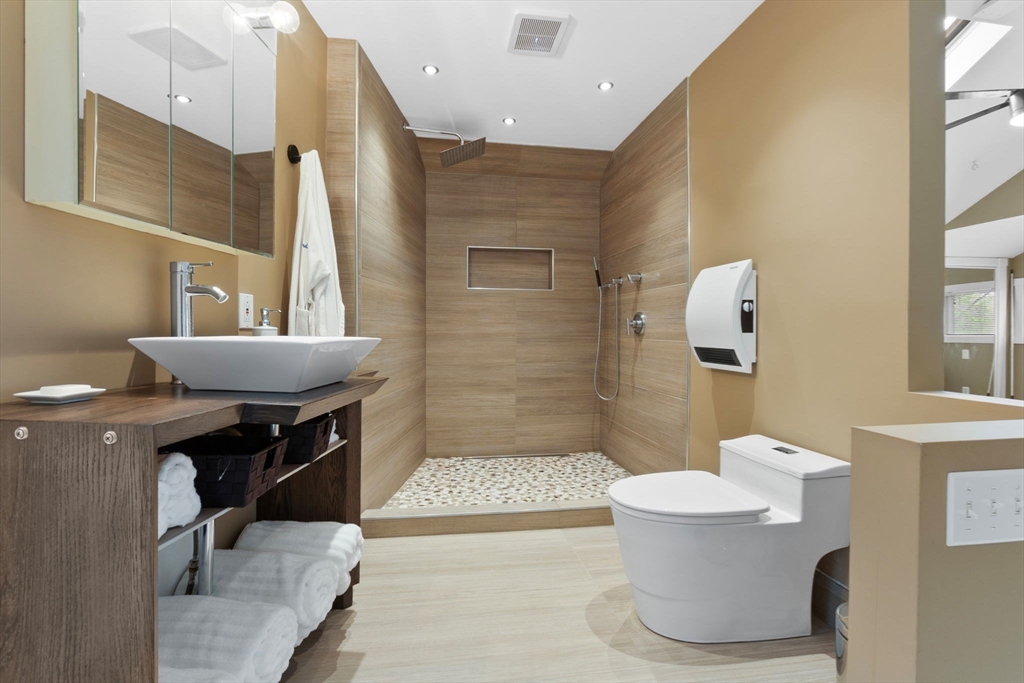 11 Bartlett Place Amesbury, MA 01913 - Photo 20 of 41 a bathroom with a sink a toilet and shower