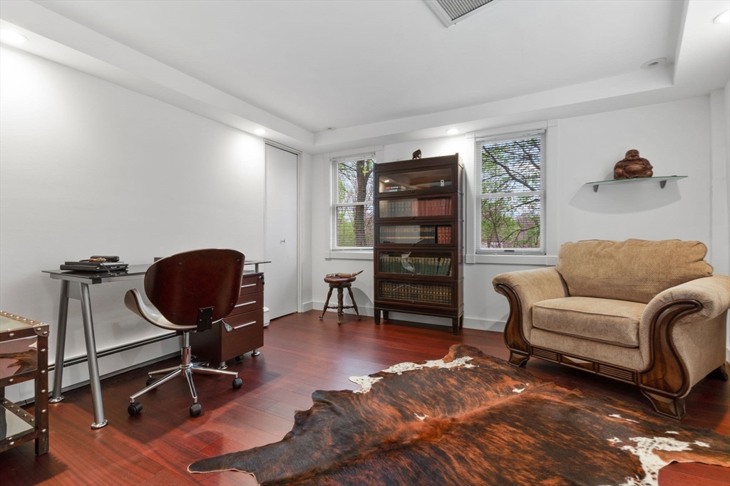 11 Bartlett Place Amesbury, MA 01913 - Photo 28 of 41 a living room with furniture a rug and gym equipment
