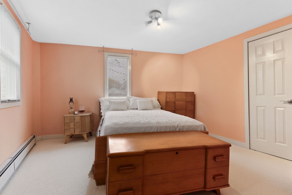 11 Bartlett Place Amesbury, MA 01913 - Photo 31 of 41 a bedroom with a bed and a table in it