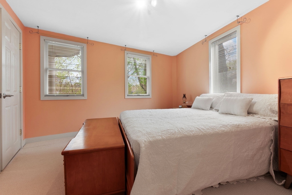 11 Bartlett Place Amesbury, MA 01913 - Photo 32 of 41 a bedroom with a bed and windows