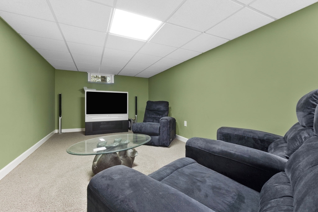 11 Bartlett Place Amesbury, MA 01913 - Photo 34 of 41 a living room with furniture and a flat screen tv