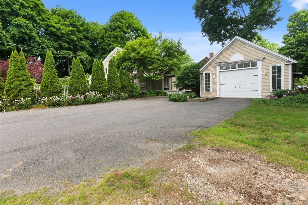 11 Bartlett Place Amesbury, MA 01913 - Photo 5 of 41 a view of a house with backyard and garden