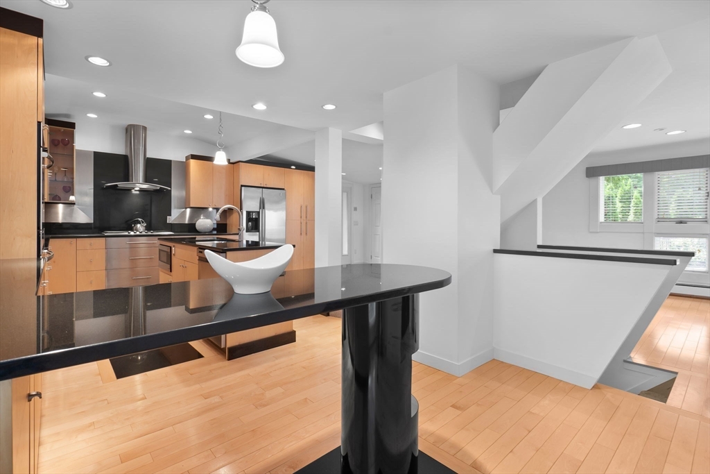 11 Bartlett Place Amesbury, MA 01913 - Photo 10 of 41 a kitchen with stainless steel appliances a sink and a refrigerator