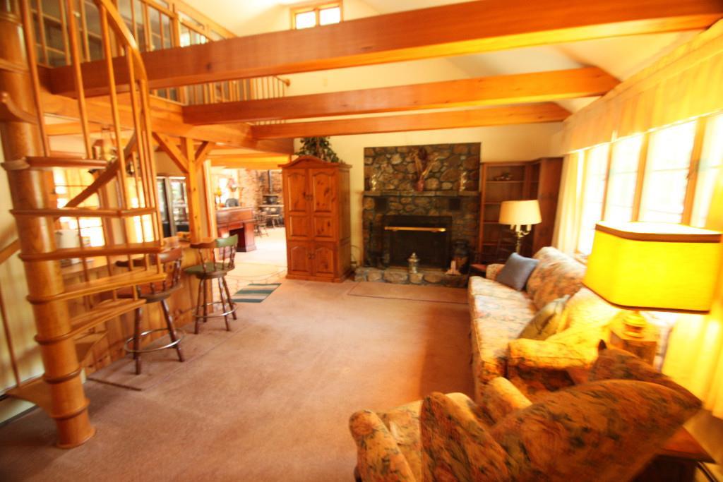 221 Northwest River Road Sebago, ME 04029 - Photo 6 of 11 Living room with fireplace.