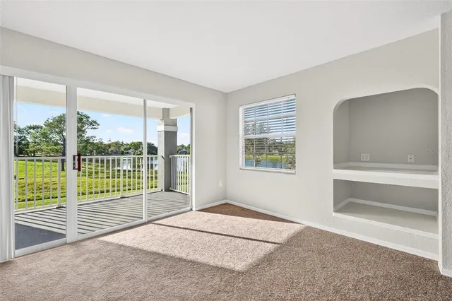 a kitchen with stainless steel appliances granite countertop a refrigerator stove and sink