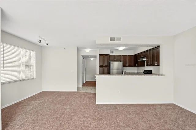 a bathroom with a toilet a sink a mirror a bathtub and vanity