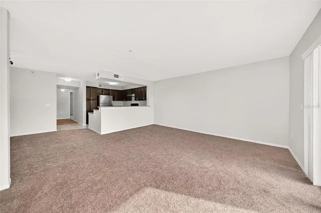 a bedroom with a bed and glass door