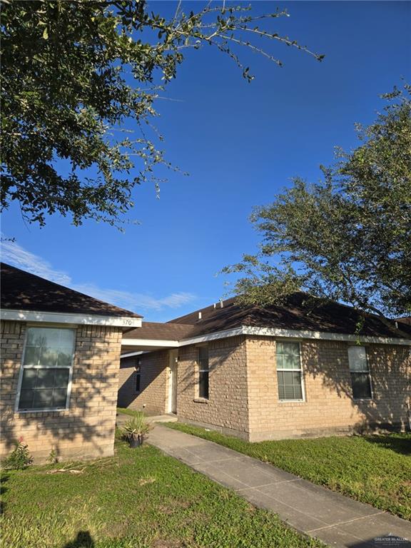 3704 South Wyndham Avenue, Unit D Pharr, TX 78577 - Photo 2 of 11 a view of a house with a yard