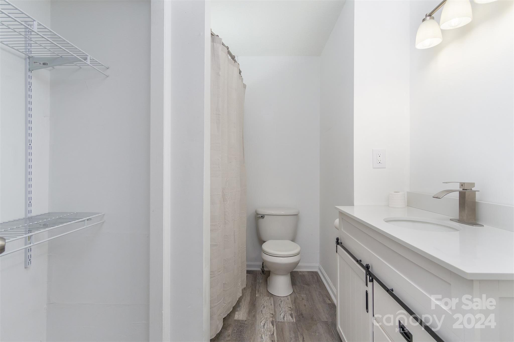 468 Deer Park Lake Road Spruce Pine, NC 28777 - Photo 13 of 46 a bathroom with a sink a toilet and a mirror