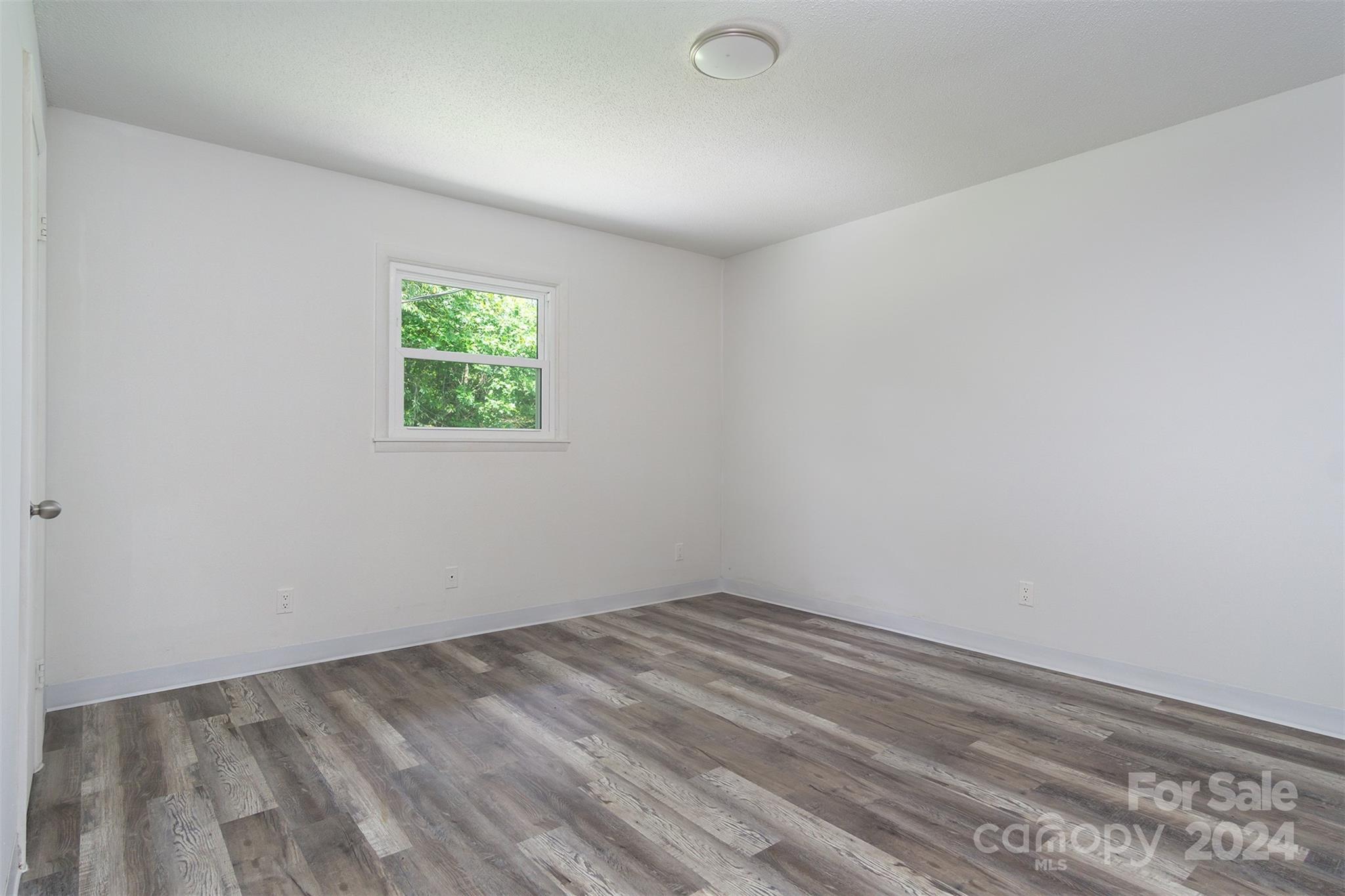 468 Deer Park Lake Road Spruce Pine, NC 28777 - Photo 20 of 46 an empty room with a window
