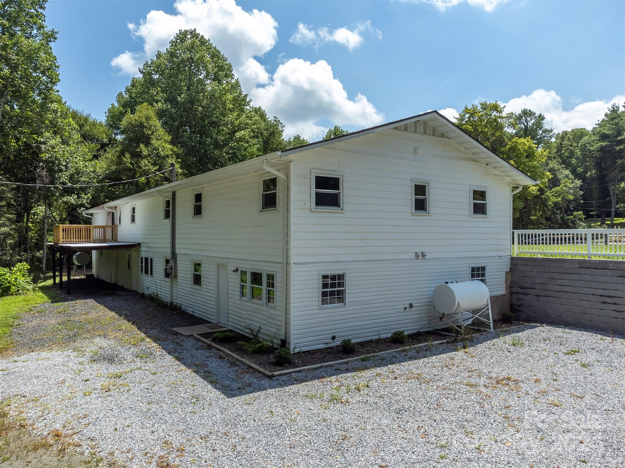 468 Deer Park Lake Road Spruce Pine, NC 28777 - Photo 25 of 46 a view of a small house with backyard