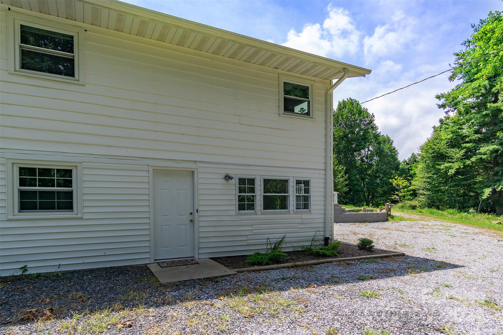 468 Deer Park Lake Road Spruce Pine, NC 28777 - Photo 29 of 46 a view of a house with a yard