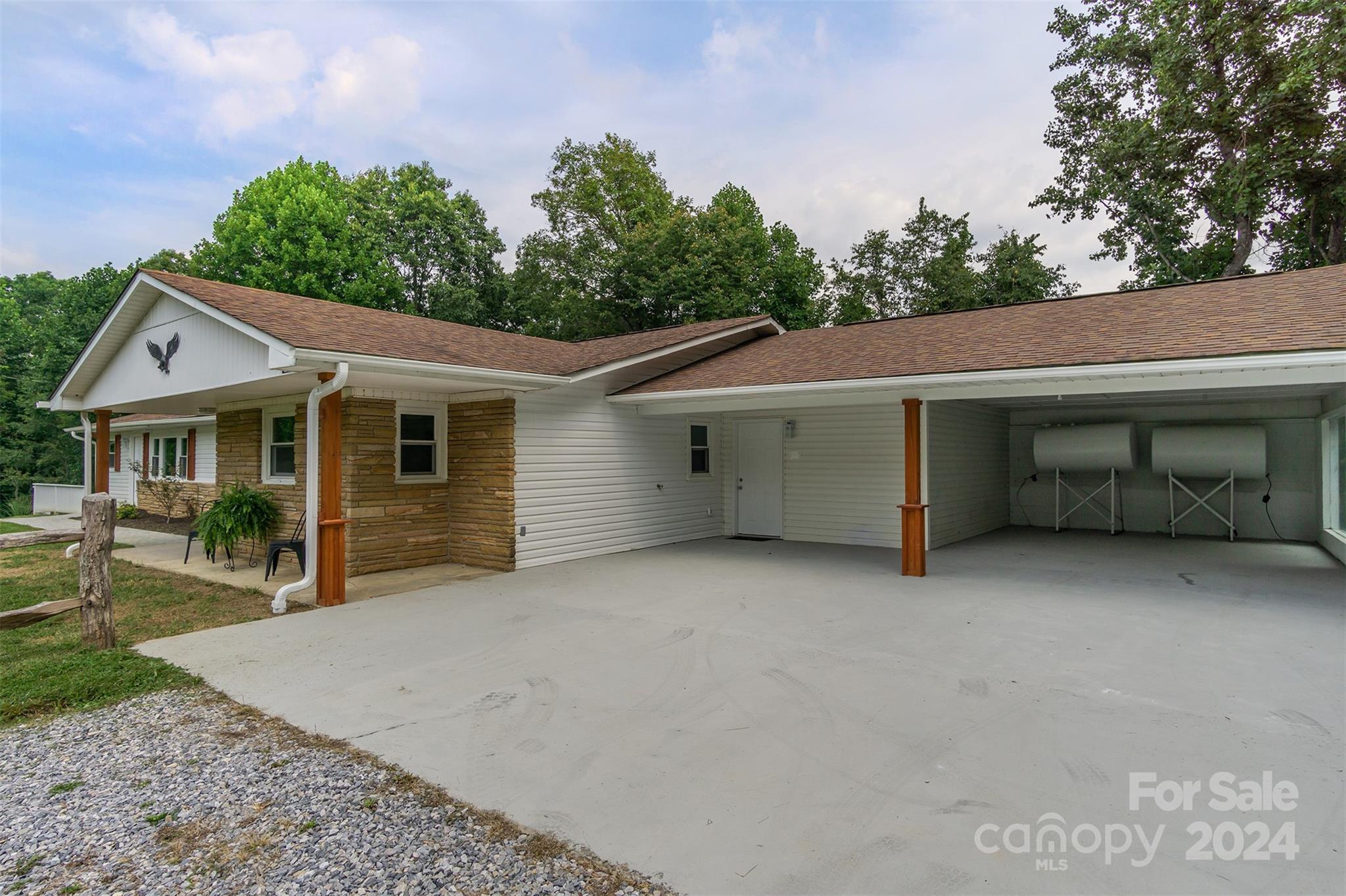 468 Deer Park Lake Road Spruce Pine, NC 28777 - Photo 3 of 46 a view of house with outdoor space and sitting area