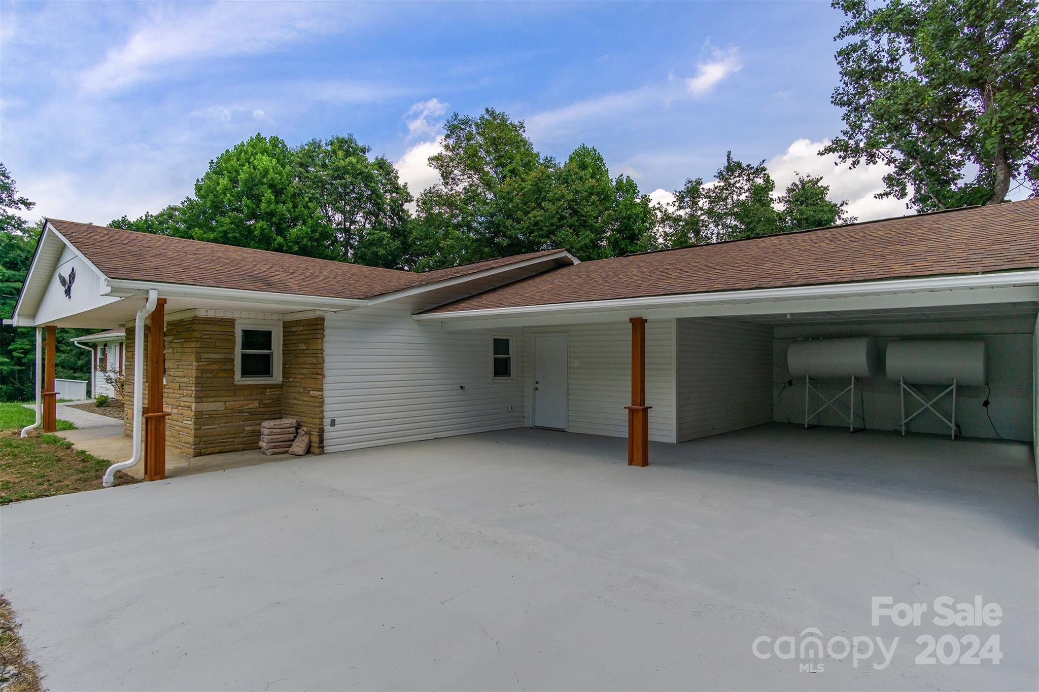 468 Deer Park Lake Road Spruce Pine, NC 28777 - Photo 31 of 46 a view of a house with a garage